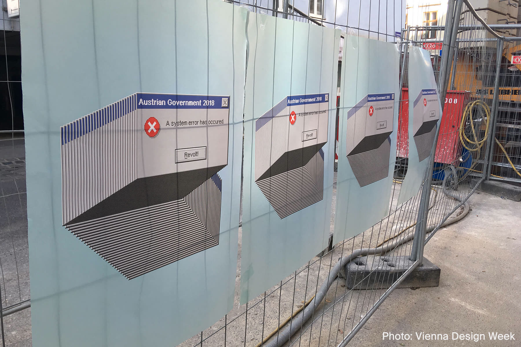 Error dialog boxes printed in perspective along a construction hoarding
