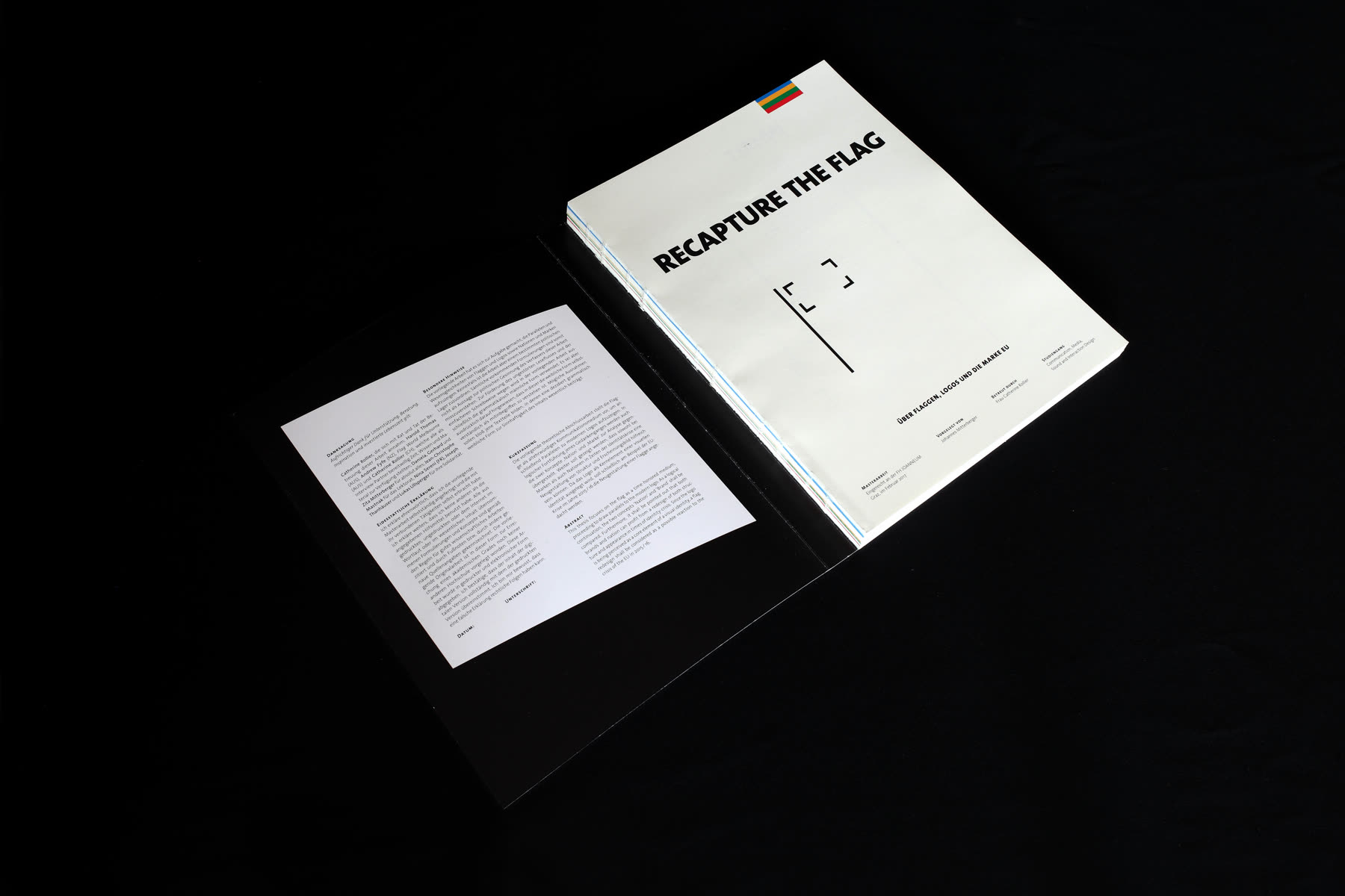The cover with a small flag drawing