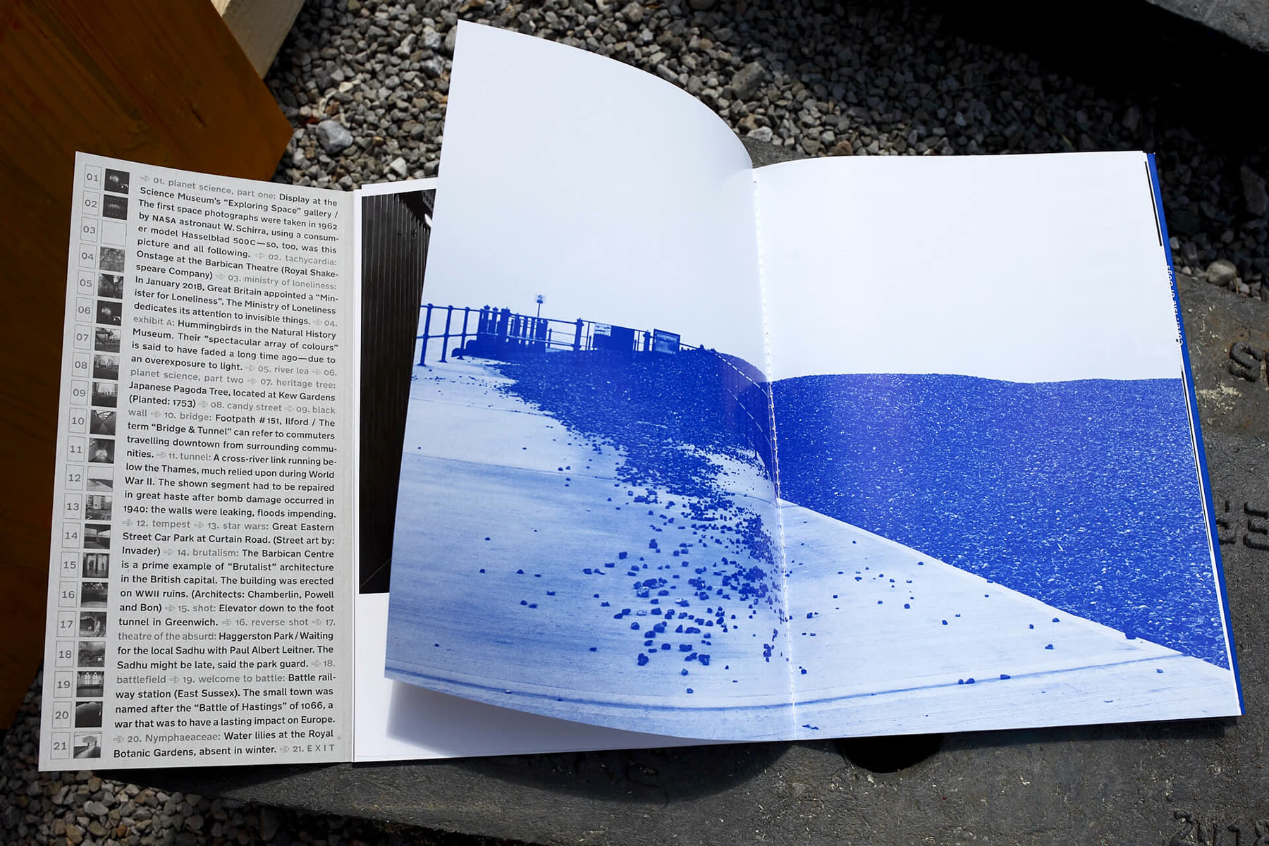 Spread with a blue photograph of the shore