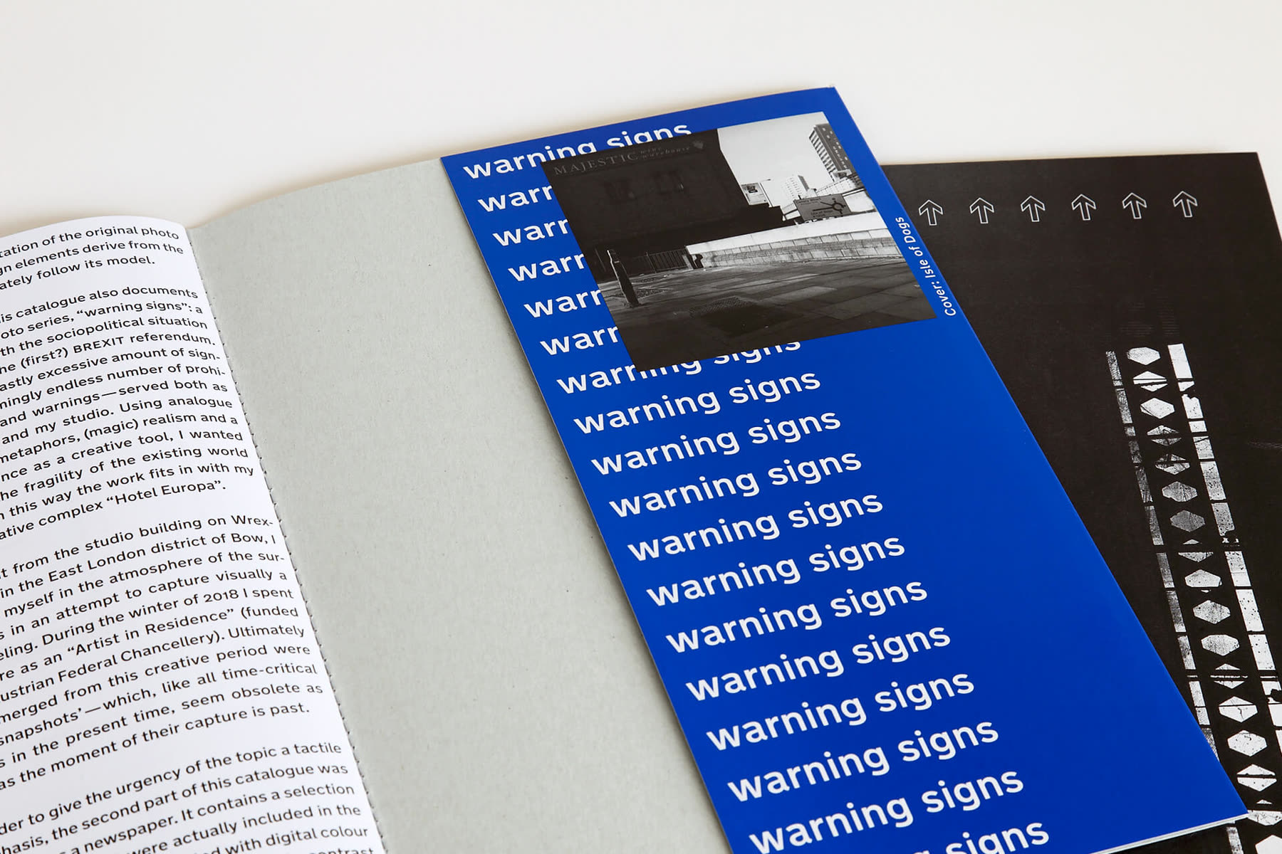 The title repeated down a blue page