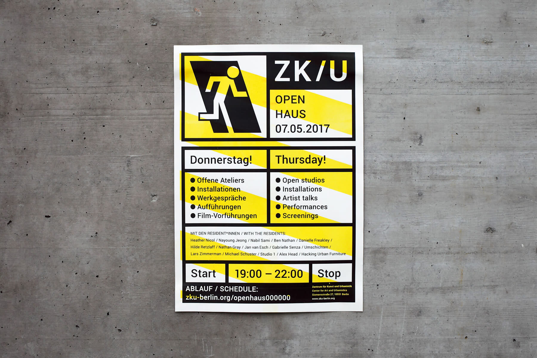 Yellow and black poster on concrete